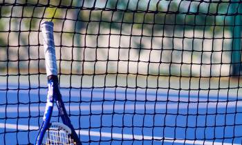 a person hitting a ball with a racket