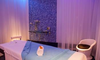 a bedroom with a bed and a curtain
