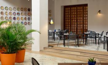 a living room filled with furniture and a table