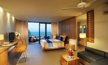 a living room filled with furniture and a flat screen tv