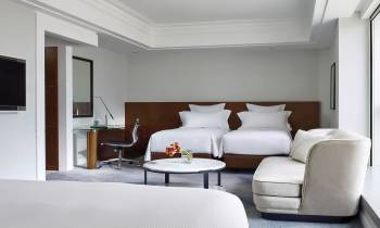 a large white bed in a room