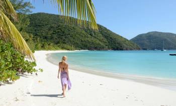 a woman standing on a beach