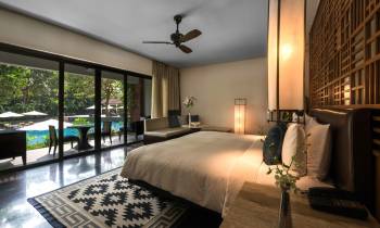 a hotel room with a bed and a large window