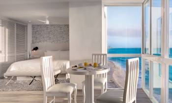 a dining room table in front of a window