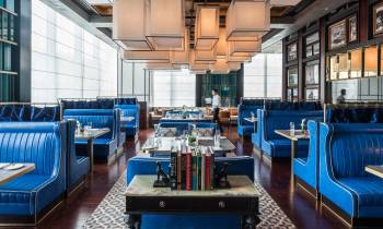 a room filled with furniture and a blue chair