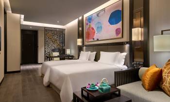 a bedroom with a large mirror