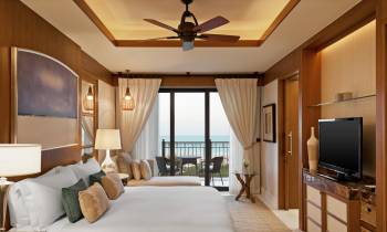 a bedroom with a large bed in a room