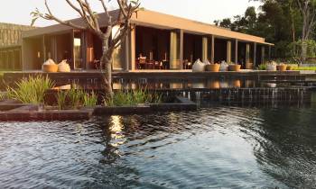 a small pond in front of a building