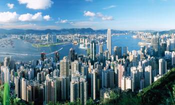 a view of Victoria Peak skyline with a mountain in the background