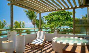 a dining room table in front of a pool