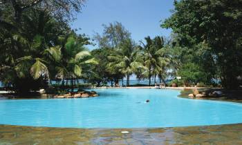 a pool next to a body of water