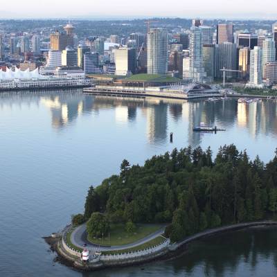 a large body of water with a city in the background