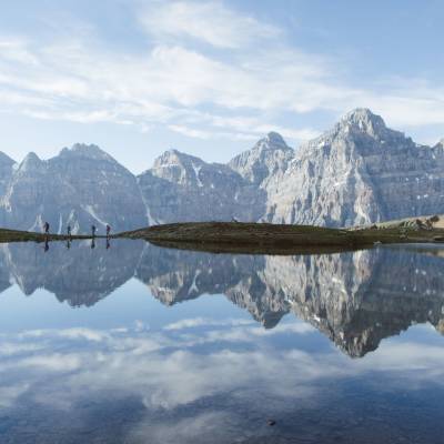 a body of water with a mountain in the background