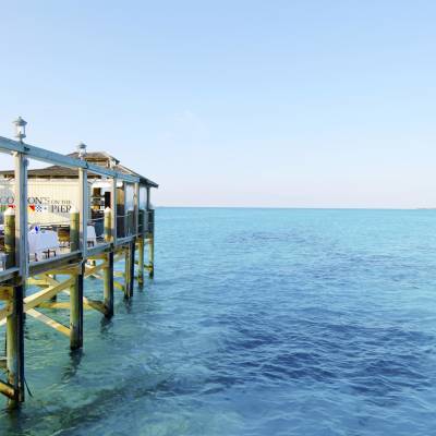 a close up of a pier next to a body of water