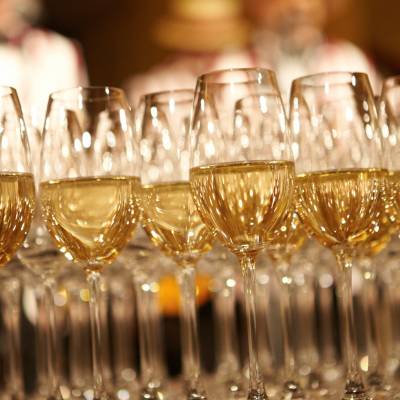 a row of wine glasses on a table