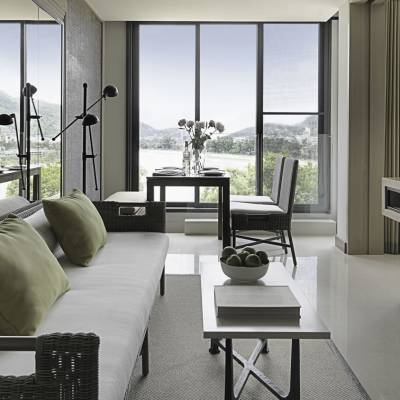 a view of a living room filled with furniture and a large window