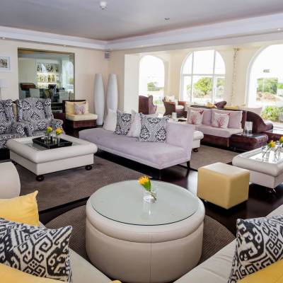 a living room filled with furniture and a large window