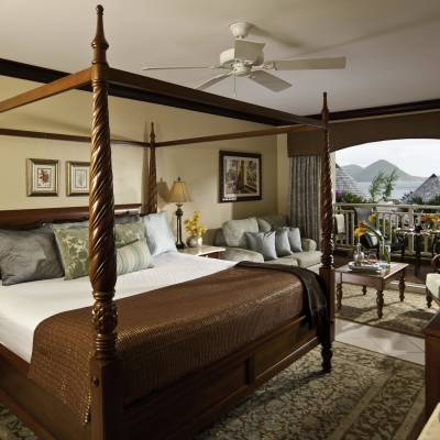 a bedroom with a large bed in a room