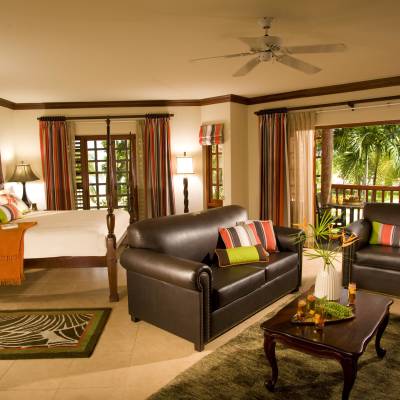 a living room filled with furniture and a large window