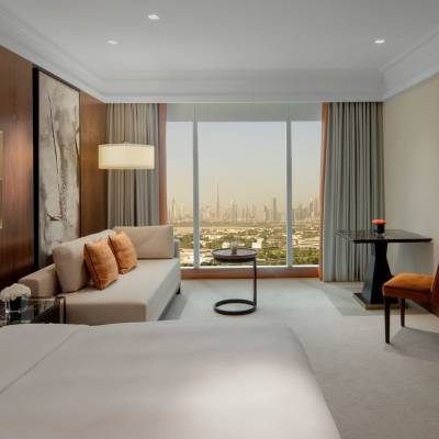 a bedroom with a large bed in a hotel room