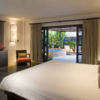 a bedroom with a large bed in a hotel room