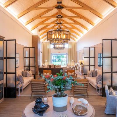 a living room filled with furniture and a large window