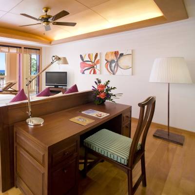 a room filled with furniture and a large window