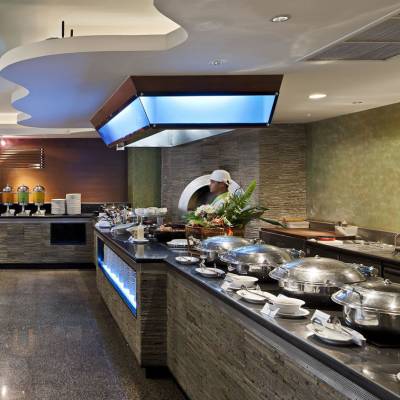 a large commercial kitchen with an island in the middle of a room