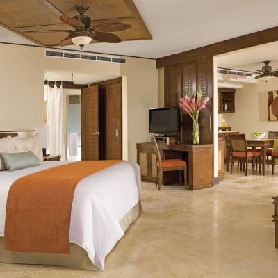 a living room filled with furniture and a bed