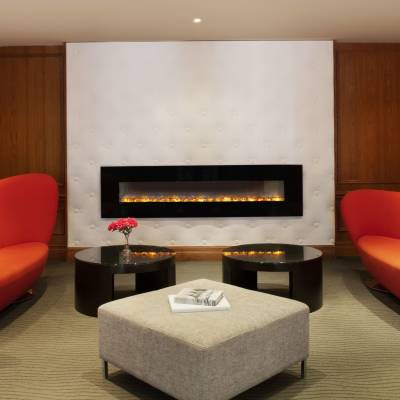 a large red chair in a living room
