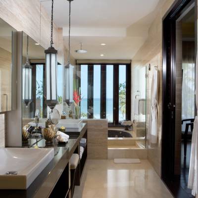 a room with a sink and a mirror