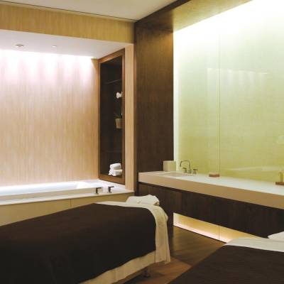a bedroom with a large mirror