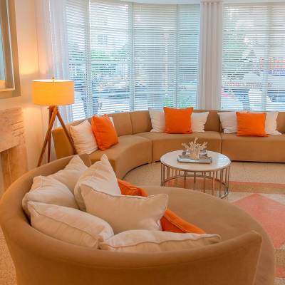 a living room filled with furniture and a large window