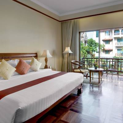 a bedroom with a large bed in a hotel room