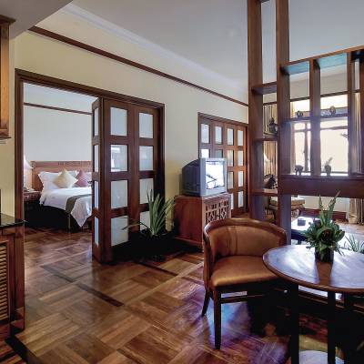 a living room filled with furniture and a large window