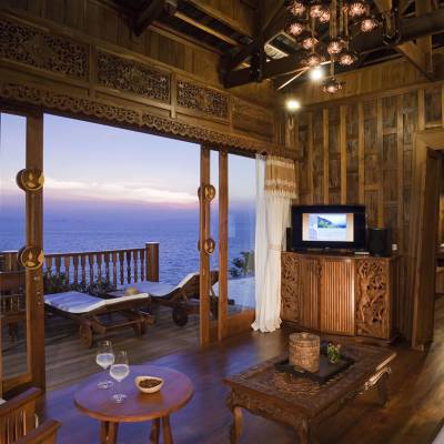 a living room filled with furniture and a large window