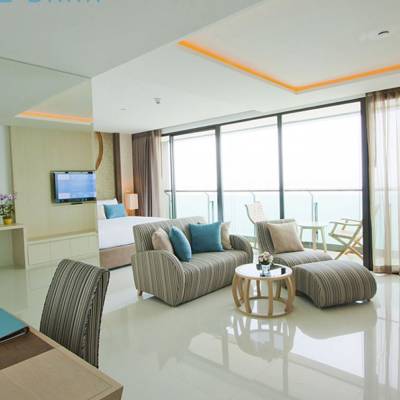 a living room filled with furniture and a large window
