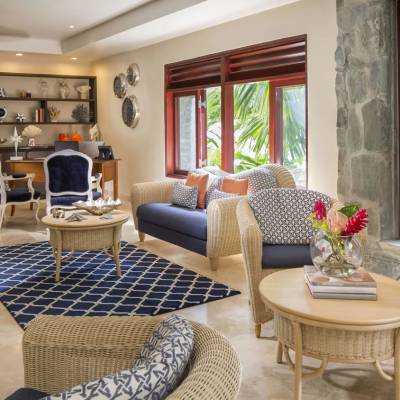 a living room filled with furniture and a fire place