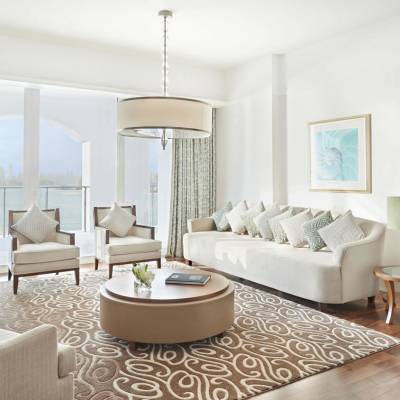 a living room filled with furniture and a large window