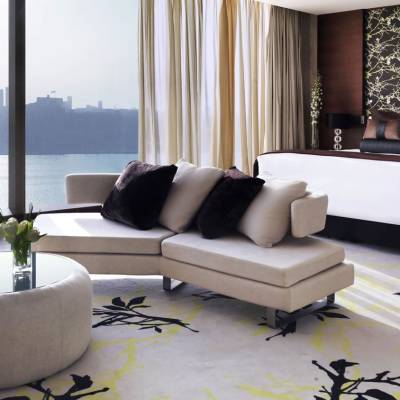a view of a living room filled with furniture and a large window