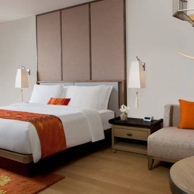 a bedroom with a bed in a hotel room