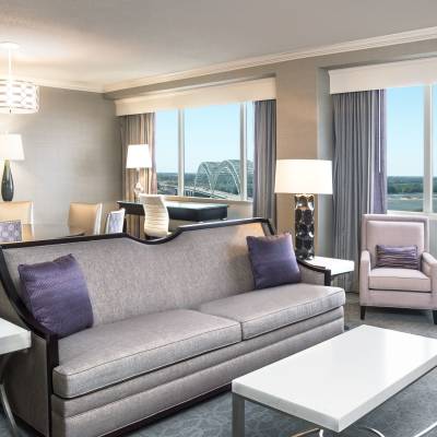 a living room filled with furniture and a large window