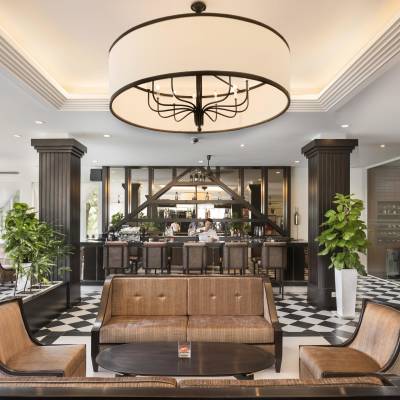 a living room filled with furniture and vase on a table