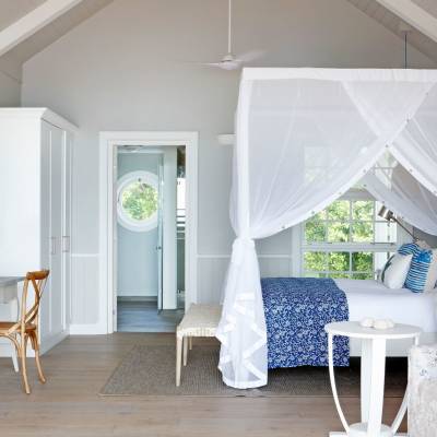 a room filled with furniture and a blue chair