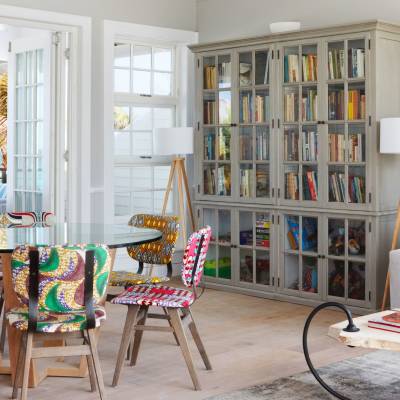 a living room filled with furniture and a large window