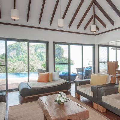 a living room filled with furniture and a large window