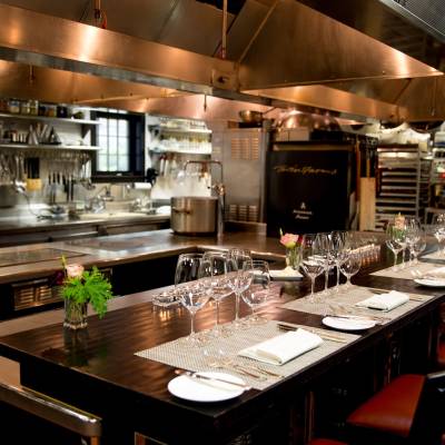 a large commercial kitchen with stainless steel appliances