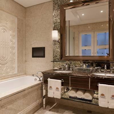 a room with a sink and a mirror