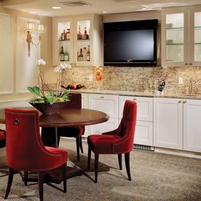 a large red chair in the living room