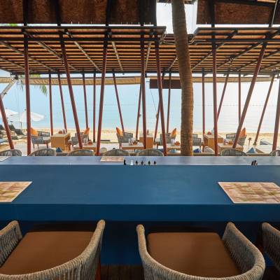 a table topped with a blue chair